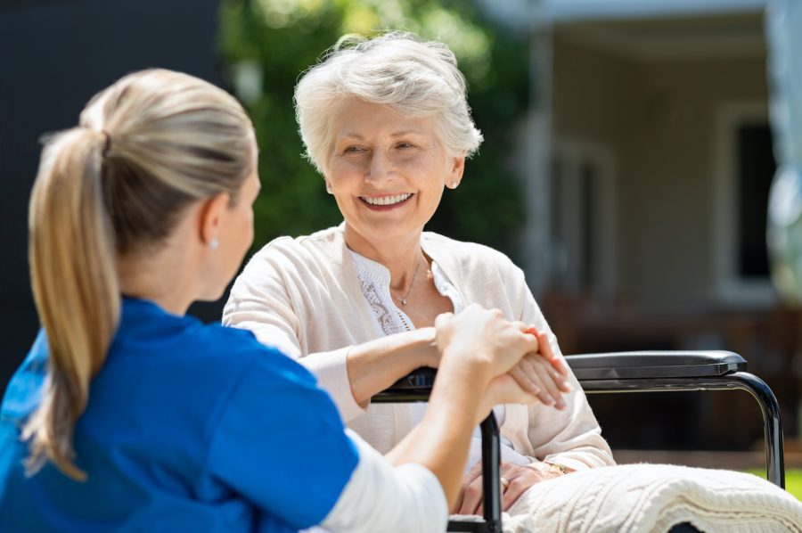 A caregiver from Legacy Home Care Los Angeles is shown completing the Client Referral Form, illustrating the simple and effective process for referring new clients to the company's professional and compassionate in-home care services.